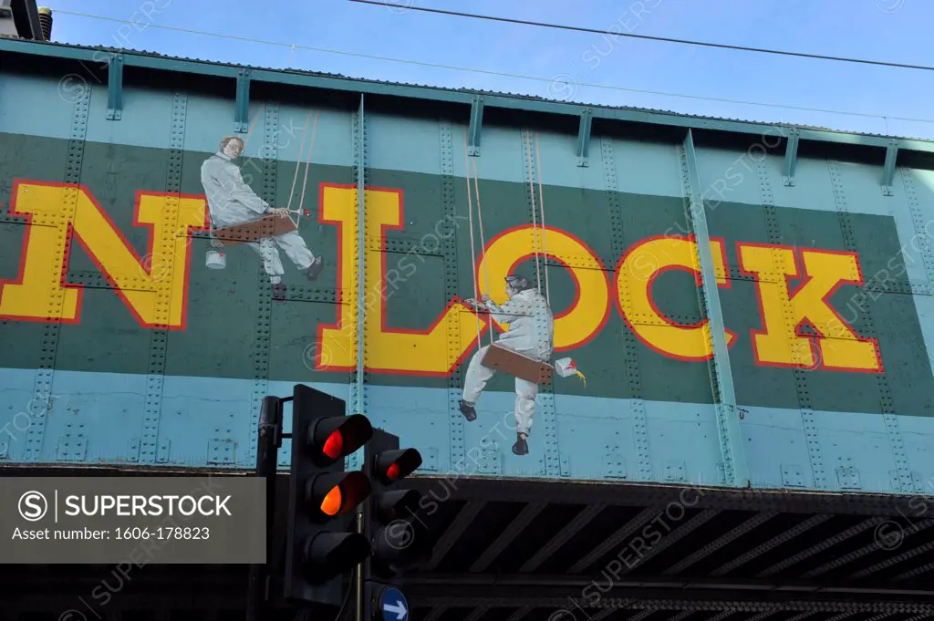 A ""trompe l'oeil"" image painted on the old railway bridge over Chalk Farm road in Camden,London,England,United Kingdom