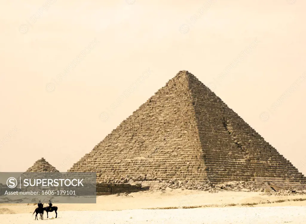 Egypt, Cairo, Giza tourists horse ridding infront of Kymerinos' pyramid