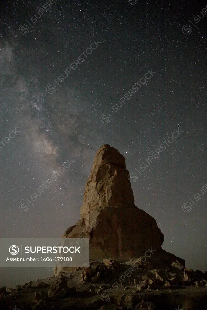 Egypt, White desert, limestone rock called ""the finger"" at night with stars ans the Milky Way
