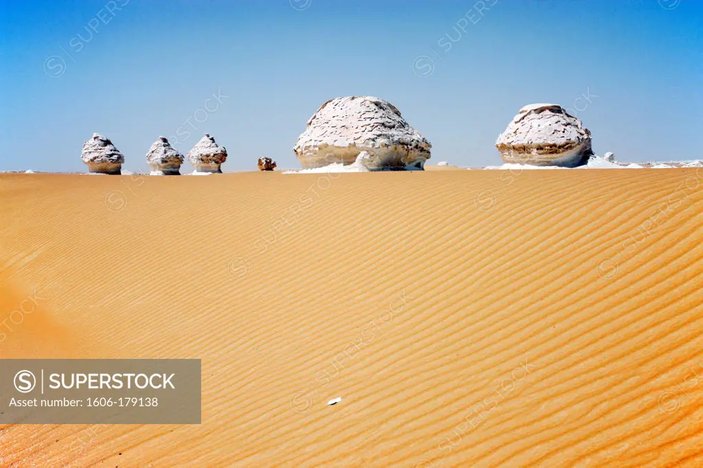 Egypt, dunes and limestone rocks in the desert