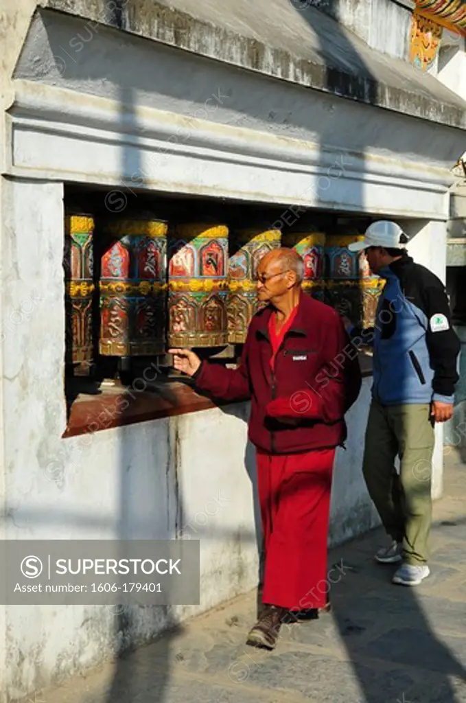 Nepal Kathmandu a tibetan monk turns the holy prayers'mil at the SWAYAMBHU temple