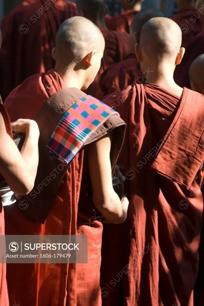 Myanmar Burma MANADALAY monks are waiting in a queue for their breakfast