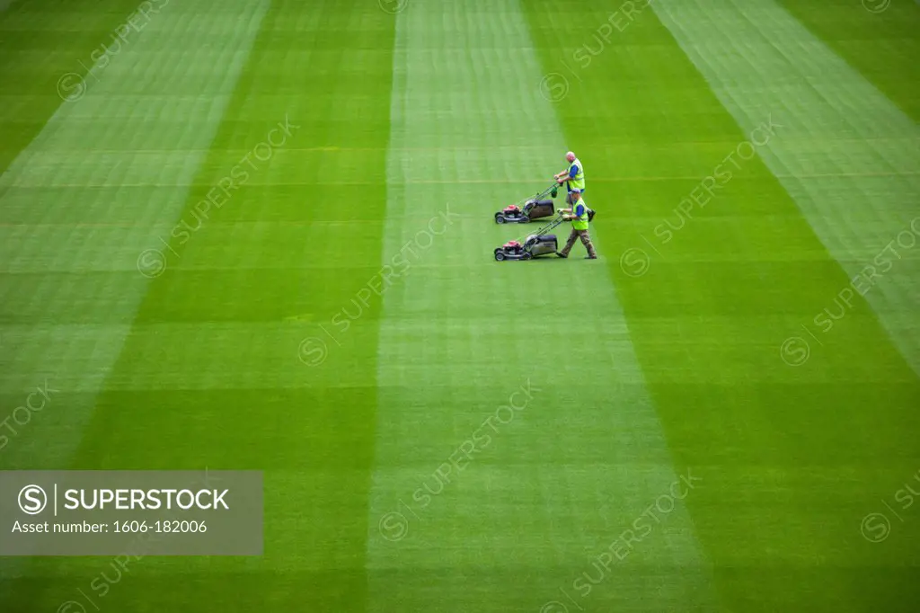 Republic of Ireland,Dublin,Greenkeeper Mowing Playing Field in The Aviva Stadium