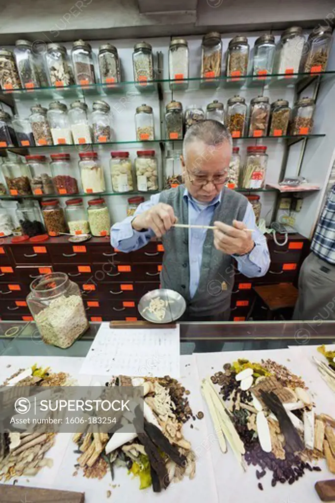 China,Hong Kong,Sheung Wan,Chinese Medicine Shop,Doctors Weighing Ingredients for Chinese Medicine Prescription