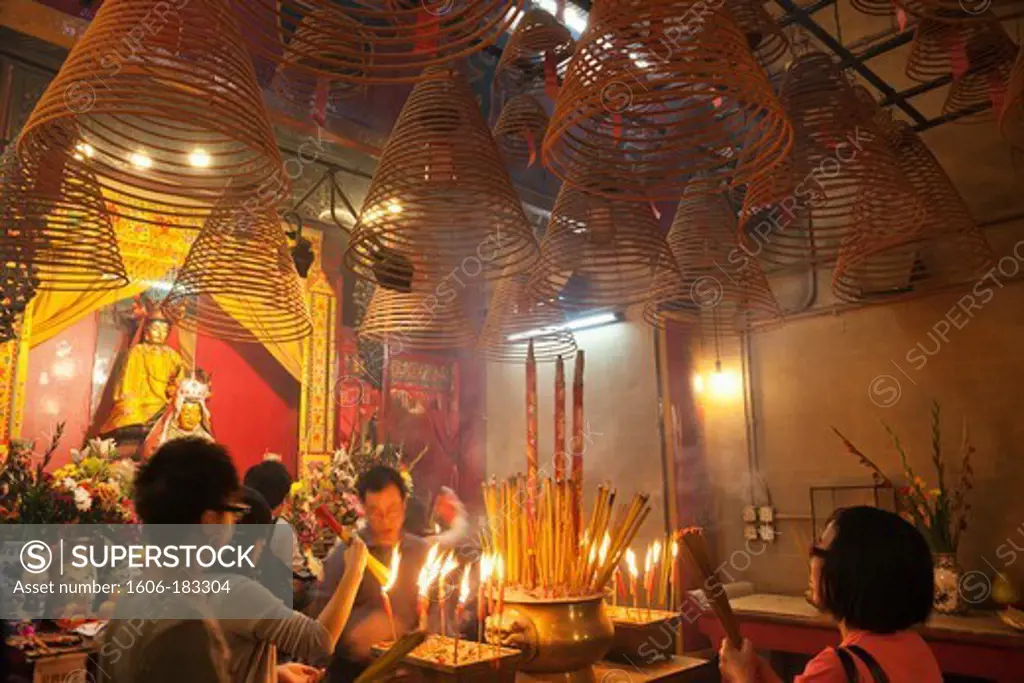 China,Hong Kong,Hollywood Road,Man Mo Temple,Worshippers Lighting Incense Sticks
