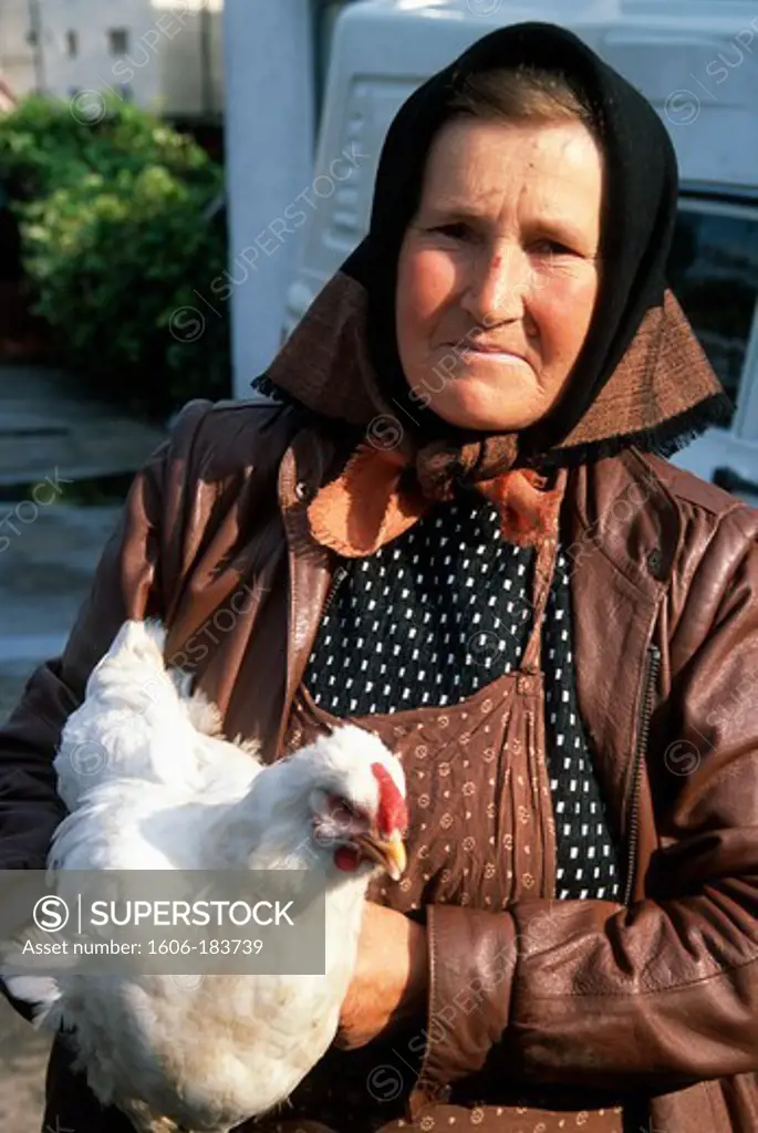 Romania, Suceava, market, vendor of chickens,