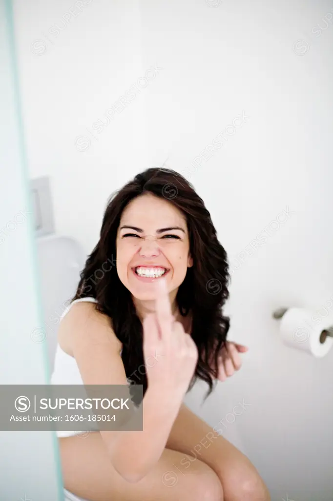 Woman making a face in the toilet