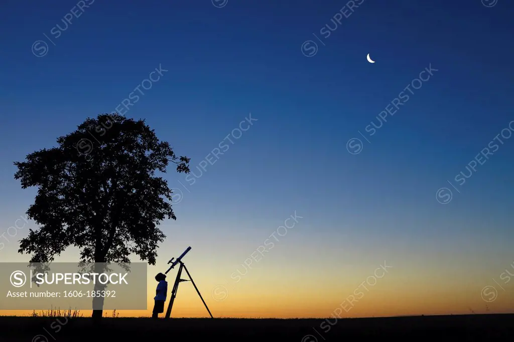 Young boy looking at the moon