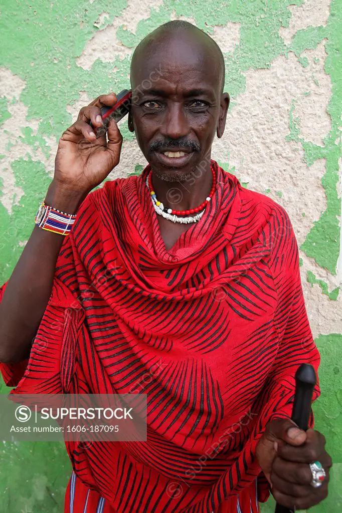 Massai using a mobile phone Lamu town. Kenya.
