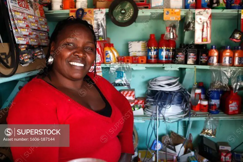 Beatrix Wanjiku, in her hardware shop financed by her 3rd loan from Opportunity microcredit (80,000 KS) Nairobi. Kenya.