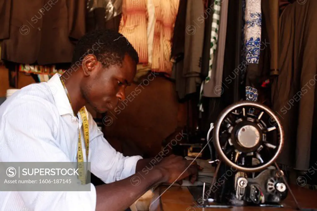 Allan Oduru opened his tayloring shop with a 25,000 KS loan from Opportunity microfinance Nairobi. Kenya.
