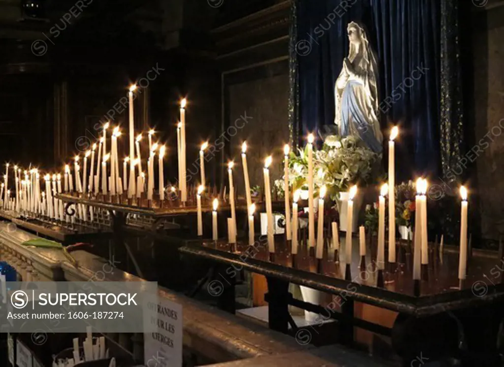 Candles in La Madeleine church Paris. France.