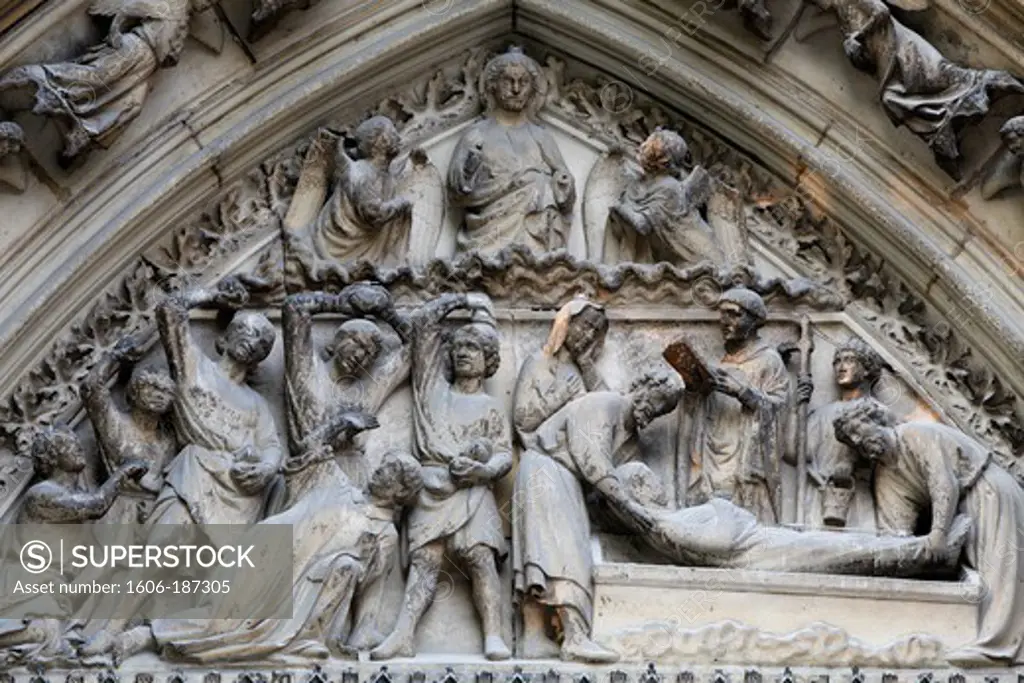 Notre Dame Cathedral. South facade. Saint-Etienne's gate tympanum sculptures depicting Saint-Etienne's life Paris . France.