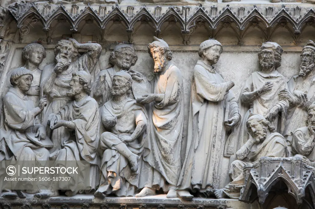 Notre Dame Cathedral. South facade. Saint-Etienne's gate tympanum sculptures depicting Saint-Etienne's life Paris . France.