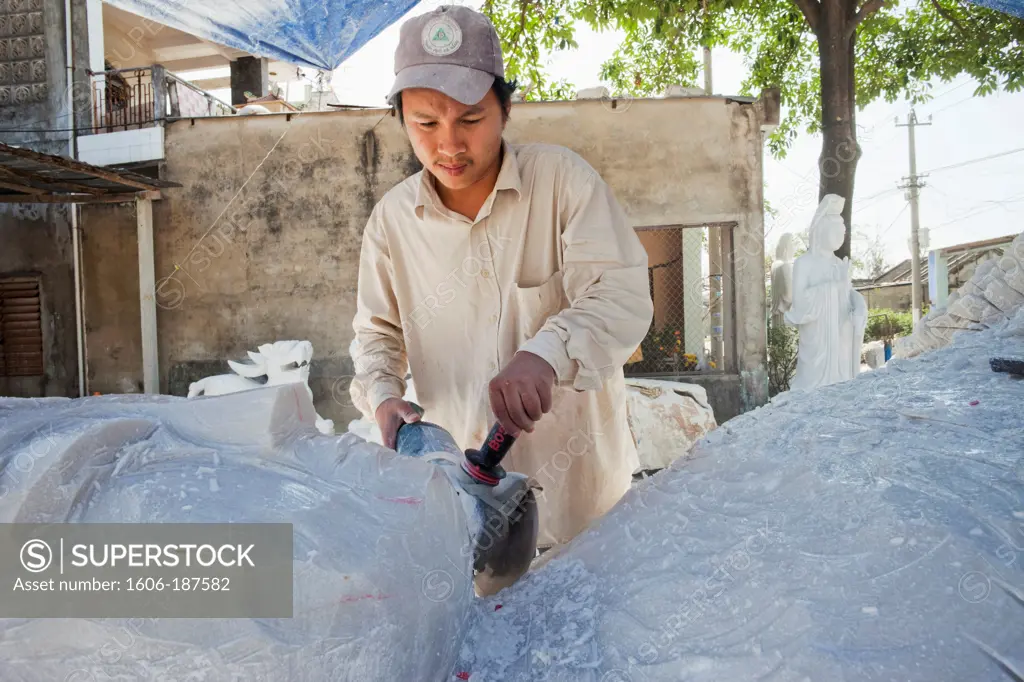 Vietnam,Hoi An,Marble Mountain,Danang,Worker Sculpting Marble Statue