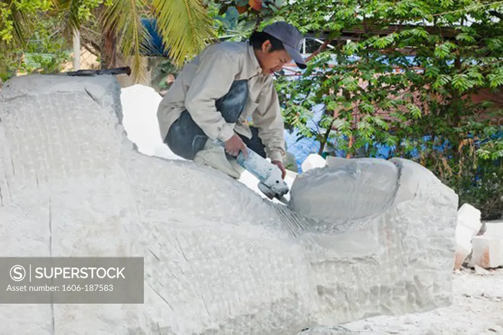 Vietnam,Hoi An,Marble Mountain,Danang,Worker Sculpting Marble Statue