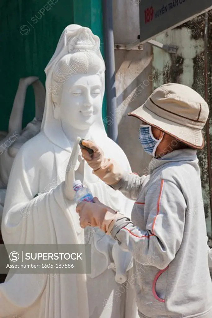 Vietnam,Hoi An,Marble Mountain,Danang,Woman Sanding Marble Statue of the Goddess of Mercy