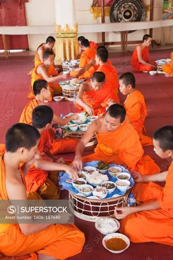 Laos,Vientiane,Monks Eating Morning Meal