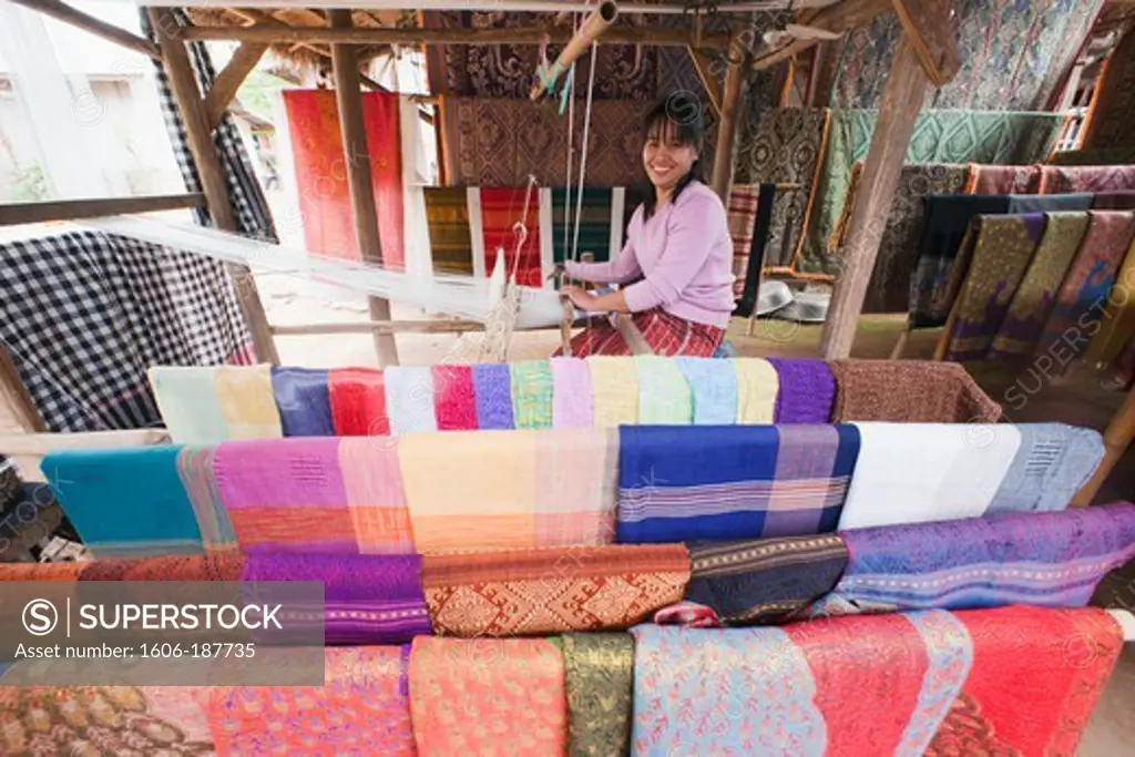 Laos,Luang Prabang,Ban Xang Hai Village,Woman Weaving Silk Scarfs
