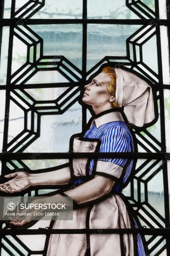 England,London,The City,St.Bartholomew the Less Chuch,Stained Glass Window depicting a Nurse