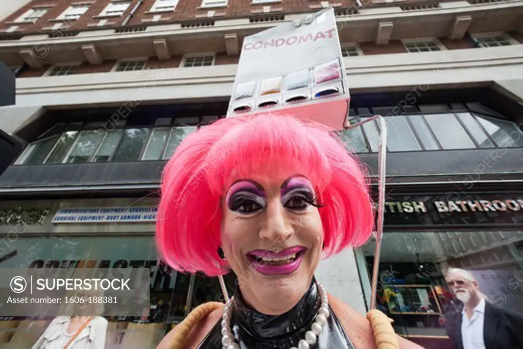 England,London,The Annual Gay Pride Parade,Female Impersonator Carrying Homemade Condom Machine