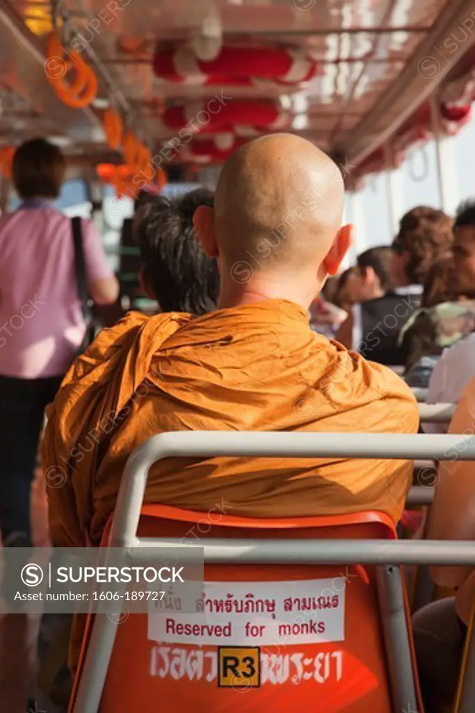 Thailand, Bangkok, Buddhist Monk in Special Seat on Riverboat