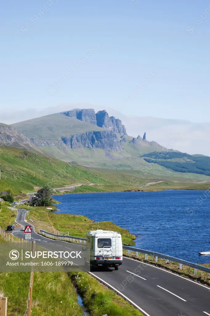 Scotland, Inner Hebrides, Isle of Skye, Camper on Road and Old Man of Storr Mountain