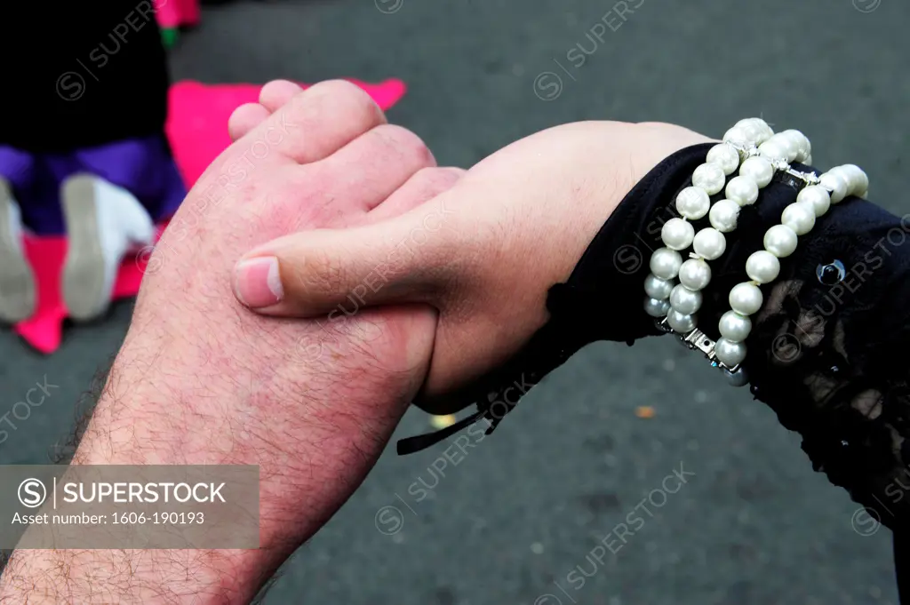 Two hands together celebrating the Paris Gay Pride Parade in France,Europe