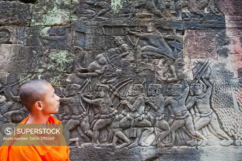 Cambodia, Siem Reap, Angkor Thom, Bayon Temple, Monk and Relief depicting the Ramayana Epic