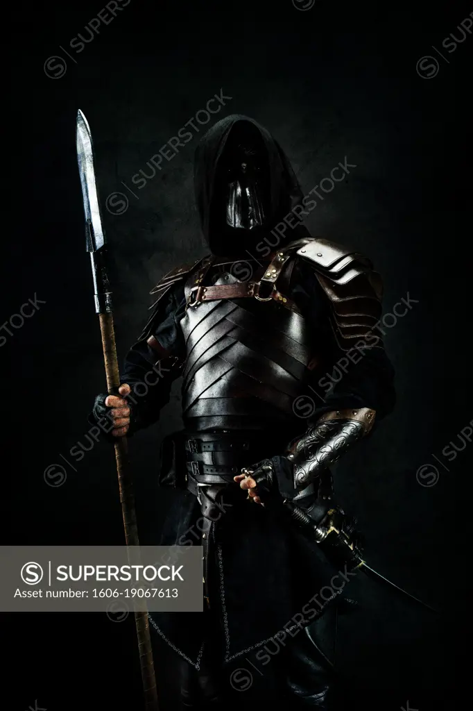 Sarmatian knight in studio on black background.