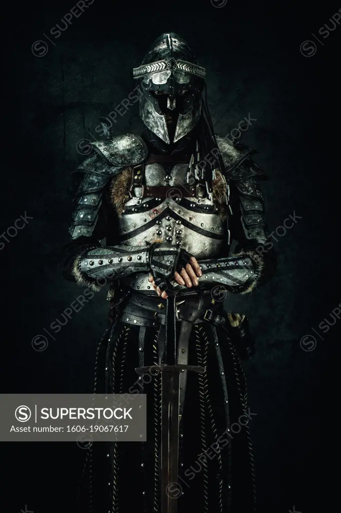 Sarmatian knight in studio on black background.