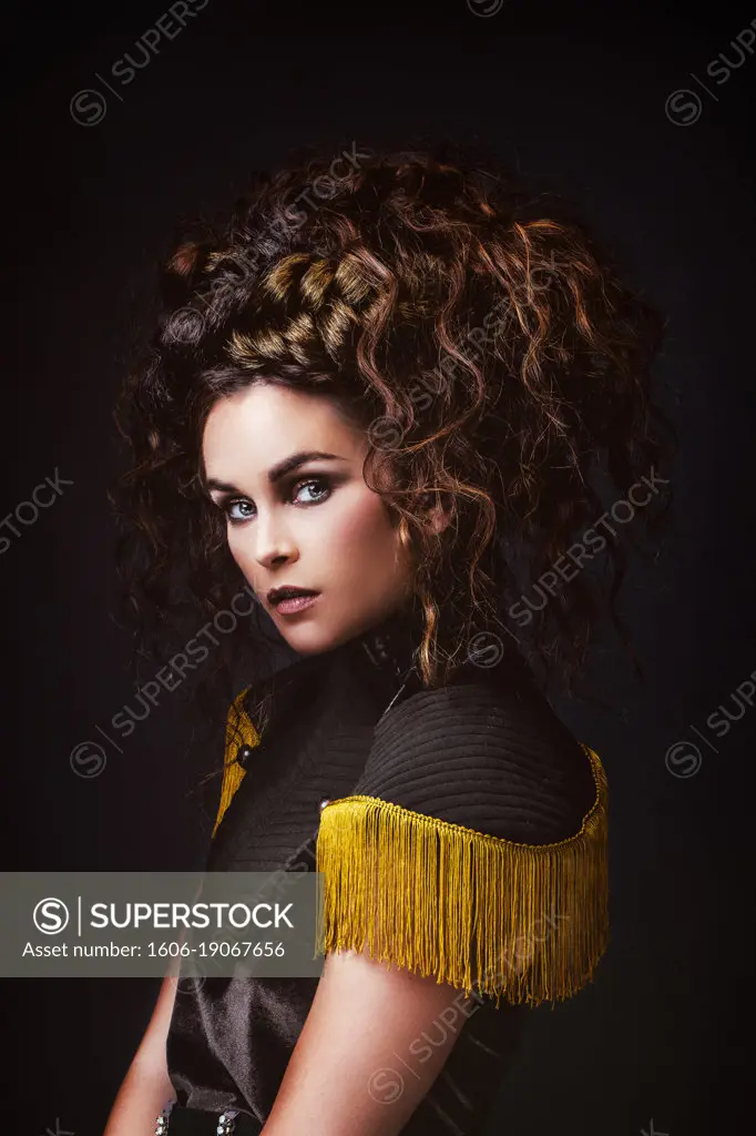 Portrait of a glamorous young woman in profile with a vintage dress.