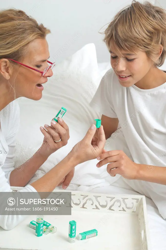 Caucasian woman with her children looking for homoeopathy