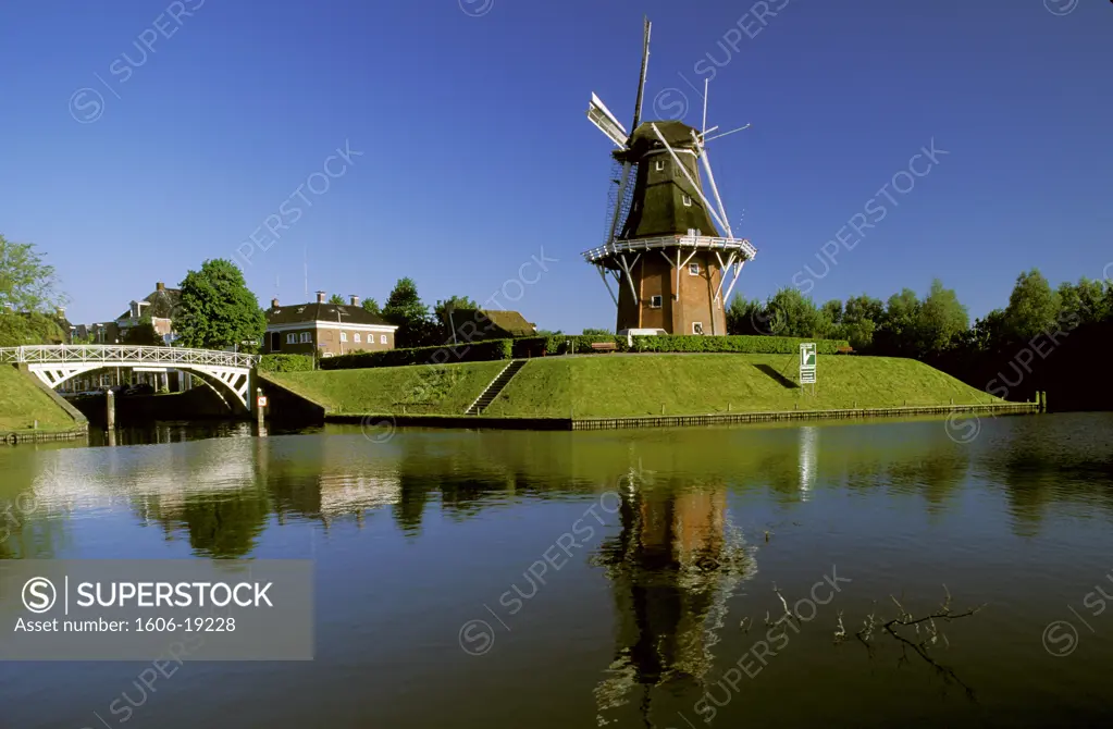 Netherlands, Frise, Dokkum, Het Grootdiep, windmill near a canal