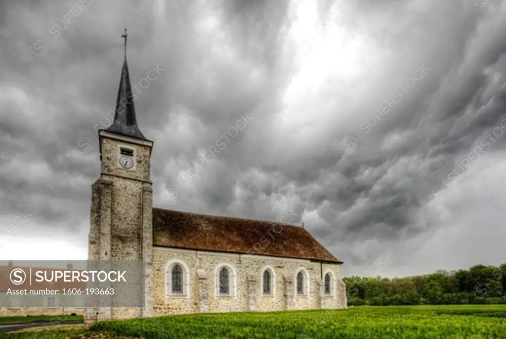 France, Seine Et Marne, Pezarches, The Church In A Storm Nascent Field Of Wheat In The Foreground