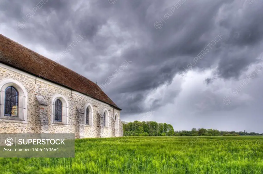 France, Seine Et Marne, Pezarches, The Church In A Storm Nascent Field Of Wheat In The Foreground