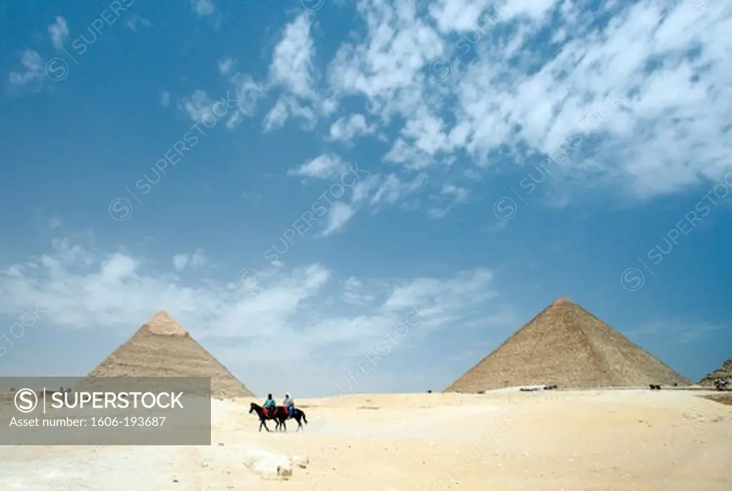 Egypt, Cairo, Giza Pyramids Of Cheops And Kefren, People On Horseback In The Foreground