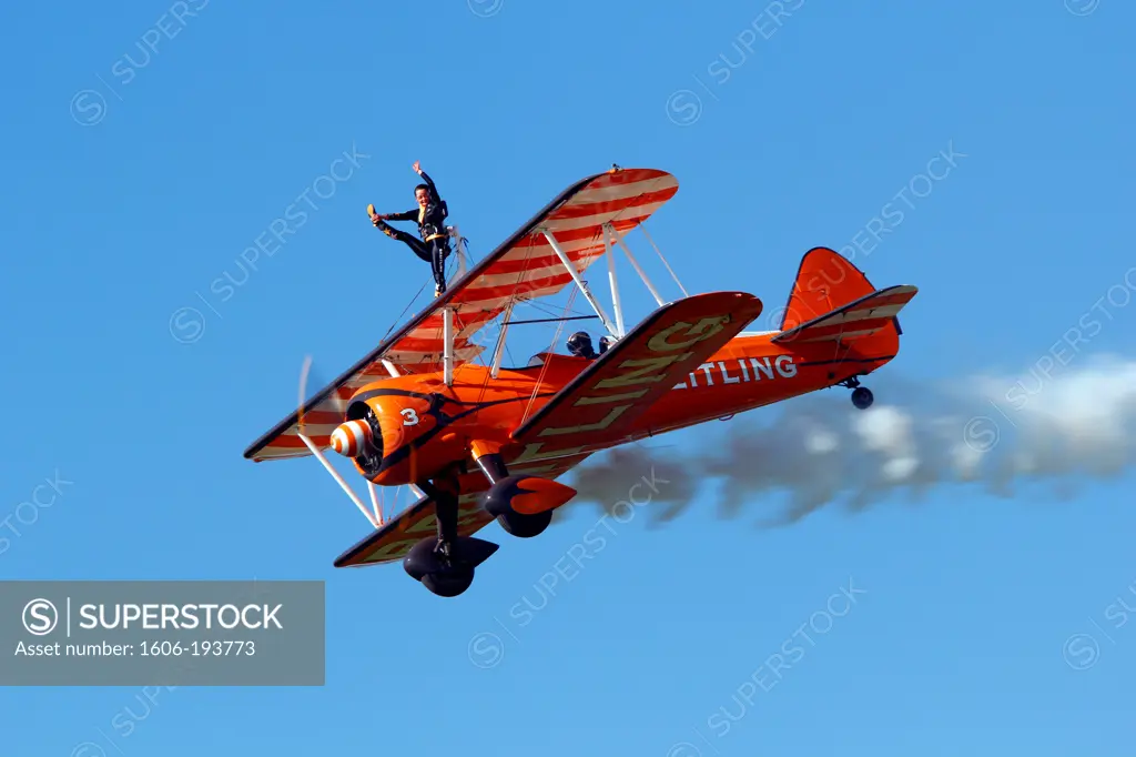 France, Essonne, La Ferte Alais, Airshow 2012. Wing Walkers On Stearman Aircraft In Full Aerobatics.