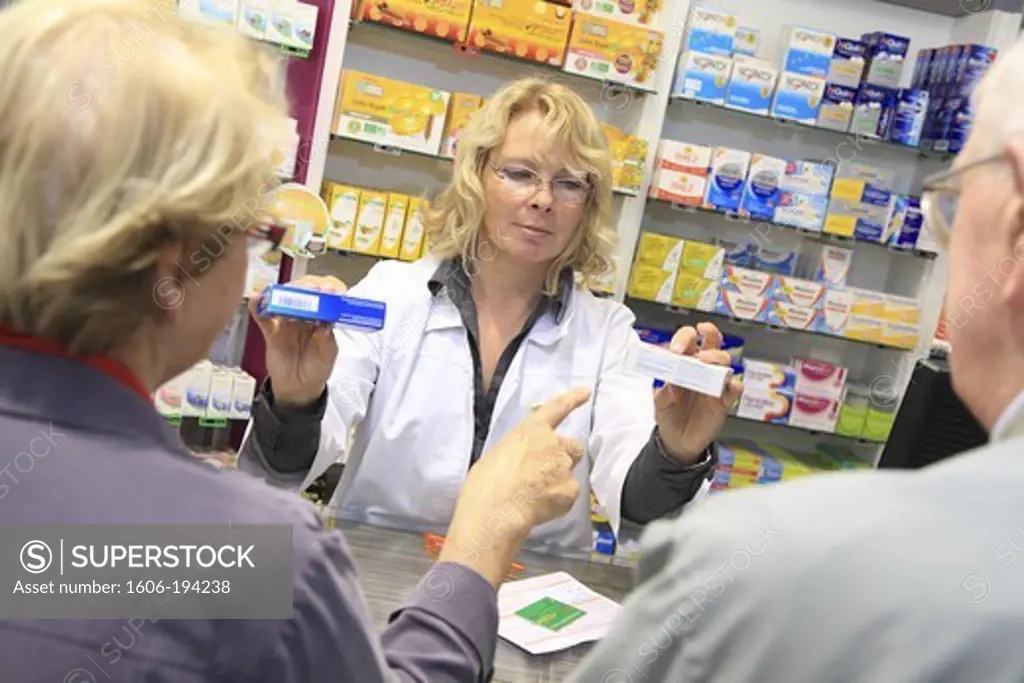 France, Drugstore, Pharmacist With A Customer