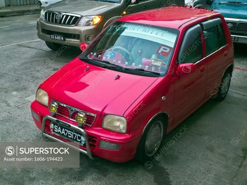Malaysia, Borneo, Sandakan, Red Car Decorated With Hello Kitty Dolls