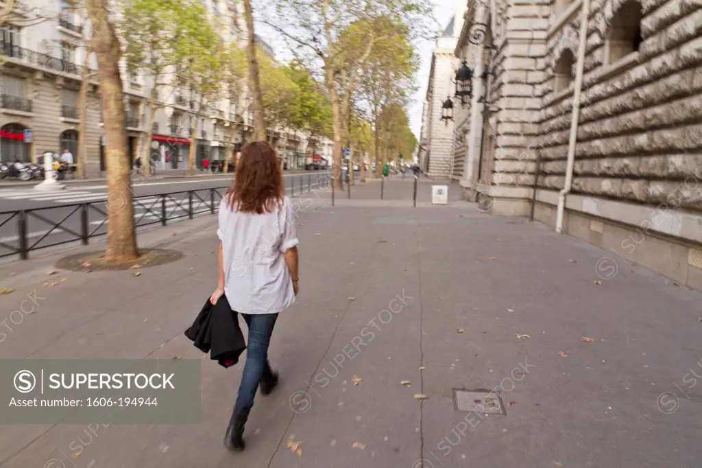 France, Paris, Woman Walking In The Street