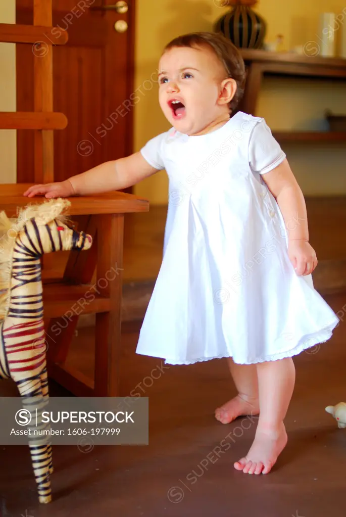 Young Girl With A Withe Dress Standing Up And Shouting