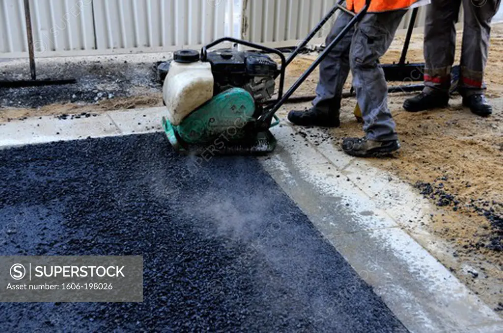 France, Pays De La Loire, Surfacing Of The Roadway In A Street, Laying The Asphalt Bitumen In Nantes City.