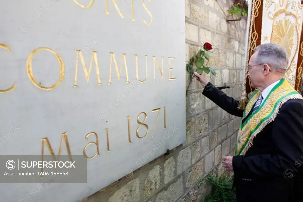 Freemason Placing A Rose On The Mur Des Federes In The Pere Lachaise Cemetery (Commemorating The Victims Of The 1871 Paris Commune) Paris. France.