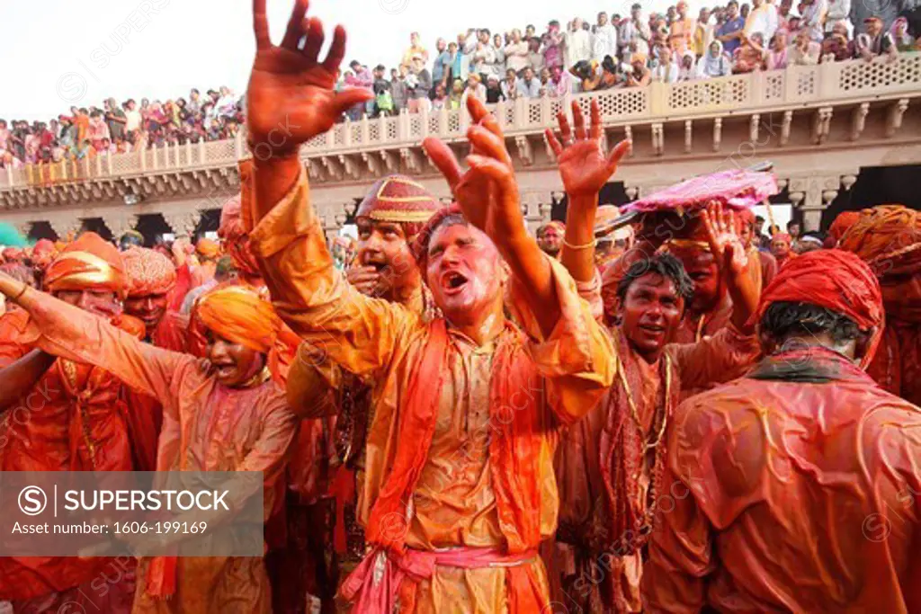 Barsana Villagers Celebrating Holi In Nandgaon, Taunting Nandgaon Villagers Who Throw Colored Fluids Over Them Nandgaon. India.