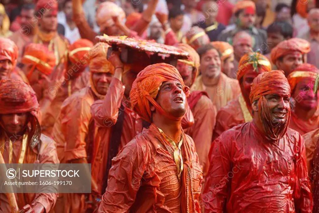 Barsana Villagers Celebrating Holi In Nandgaon, Taunting Nandgaon Villagers Who Throw Colored Fluids Over Them Nandgaon. India.