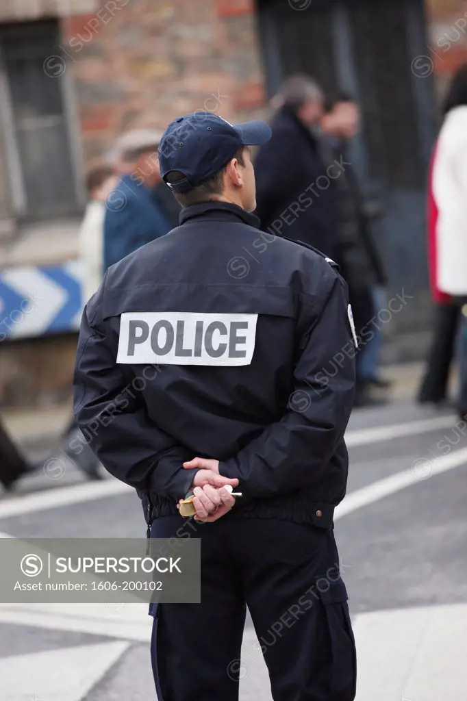 France. Seine Et Marne. Coulommiers. Policeman Watching People In The Street.