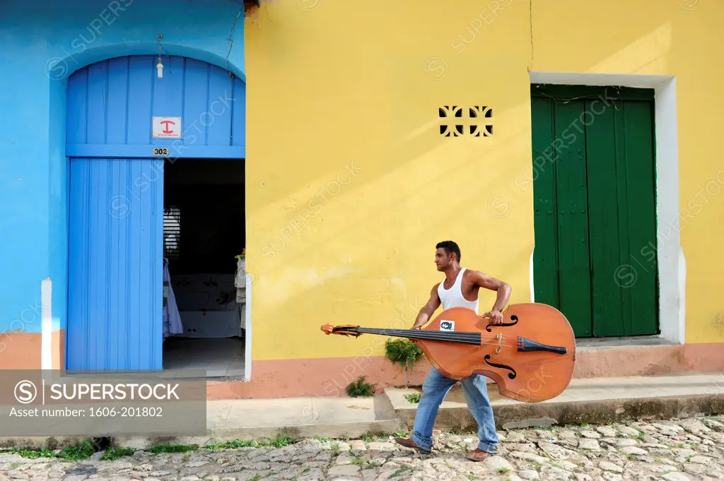 Man Holding Contrabass  In Trinidad, Sancti Spiritus Province, Cuba