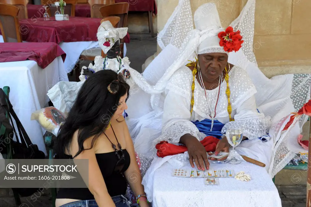 Woman Reading Cards Of Santeria Religion Cult Dressed In White In Havana, Cuba