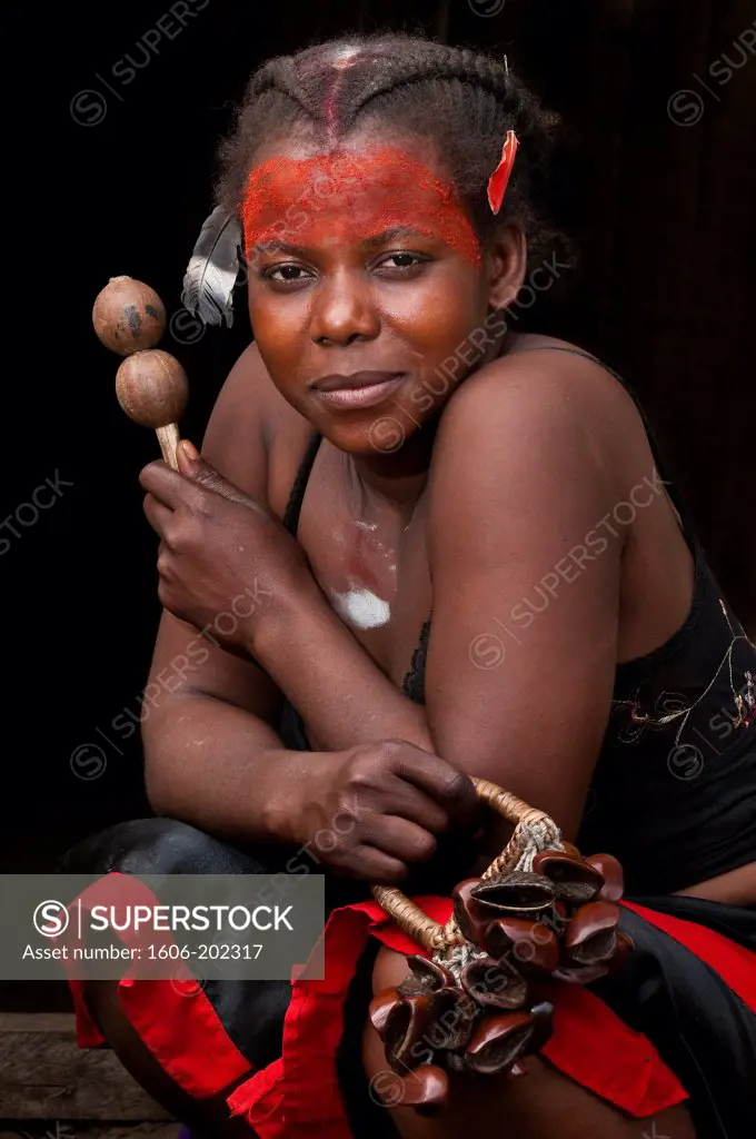 Africa, Gabon, Estuaire Region, Tsango Island, Bwiti Ceremonies, Nadege Doki ( Initiated 'Tsingo') Painted With Kaolin Holding A  Rattle Named 'Soke' And A Music Instrument Named 'Bitsanza'